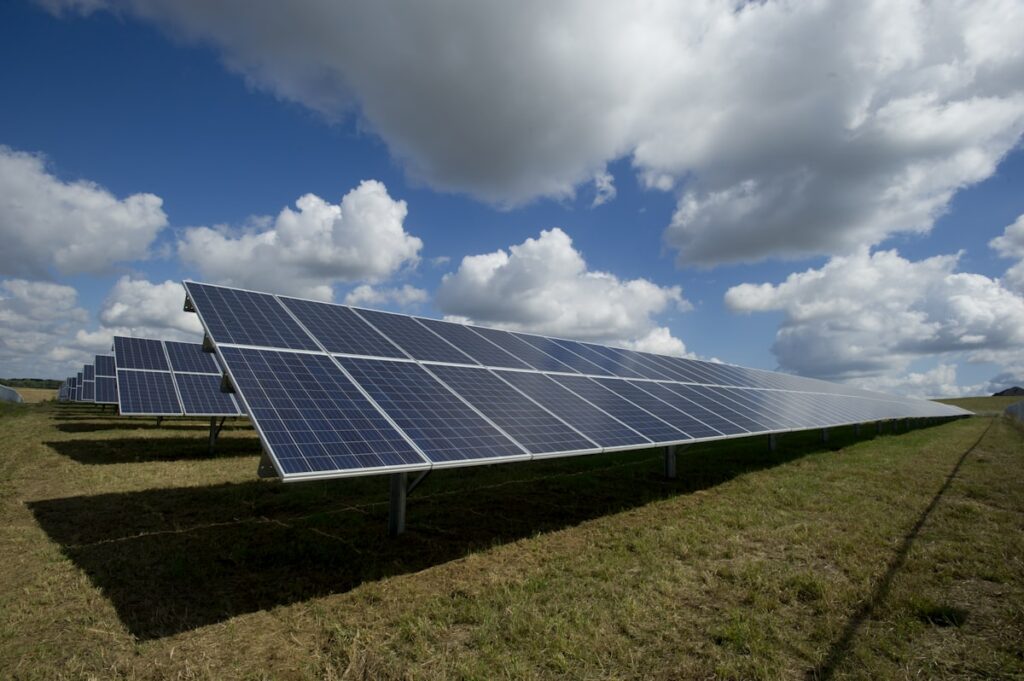 Solar panel installation technician working on a rooftop solar array in Nigeria
